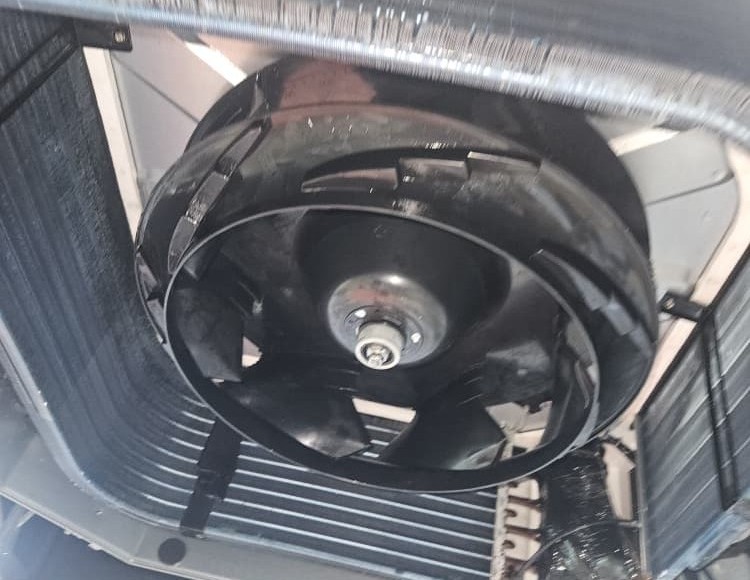 Technician opening indoor unit for aircond water leakage repair KL